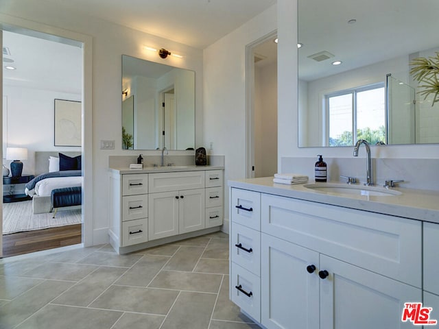 bathroom featuring tile floors and dual bowl vanity