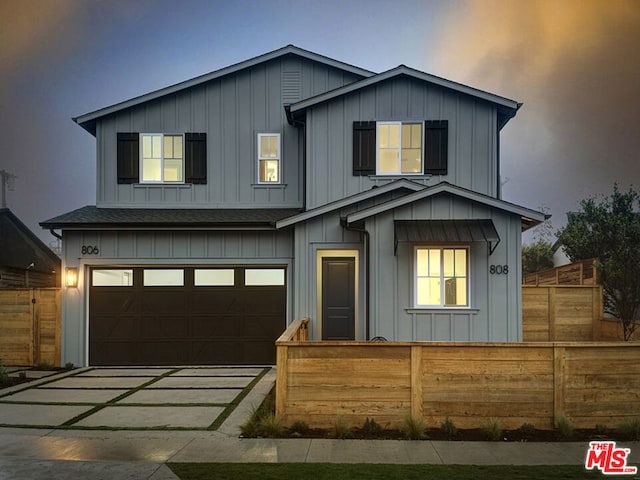 view of front of property featuring a garage