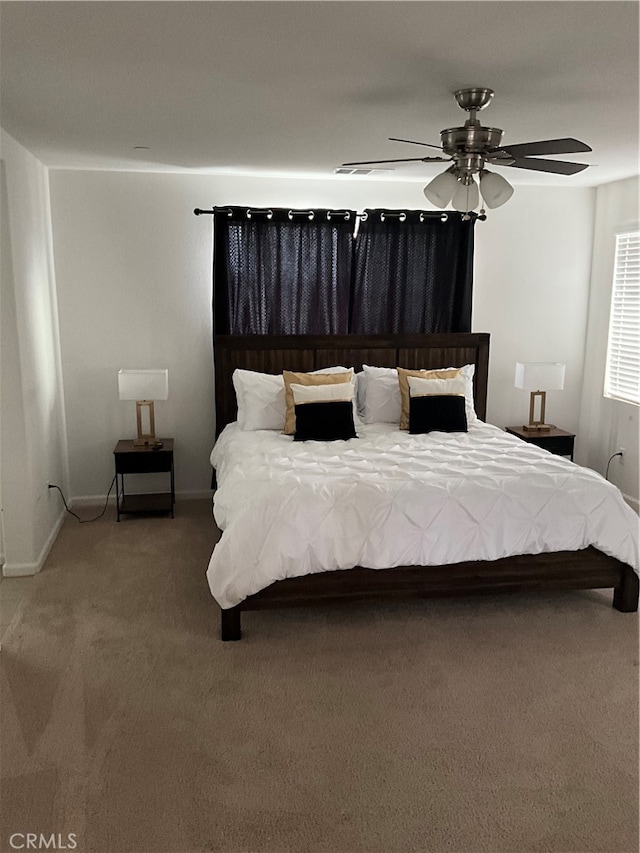 carpeted bedroom featuring ceiling fan