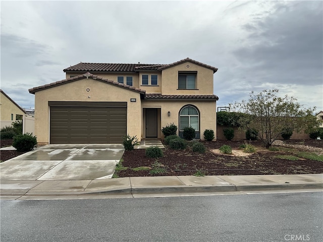 mediterranean / spanish-style house featuring a garage