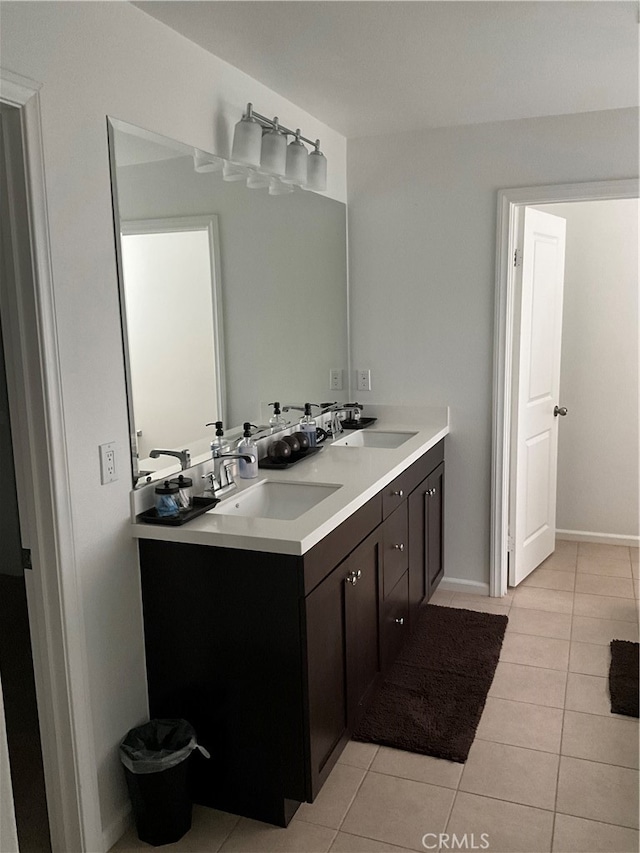 bathroom featuring double sink vanity and tile flooring