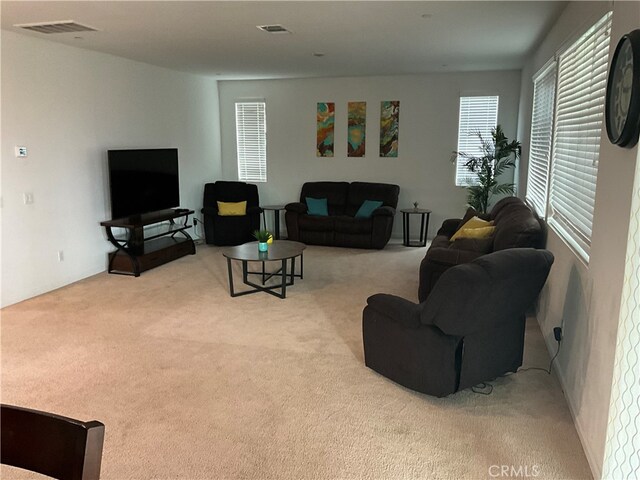 living room featuring light carpet