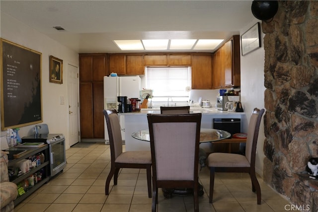 kitchen featuring stainless steel electric range oven and light tile floors