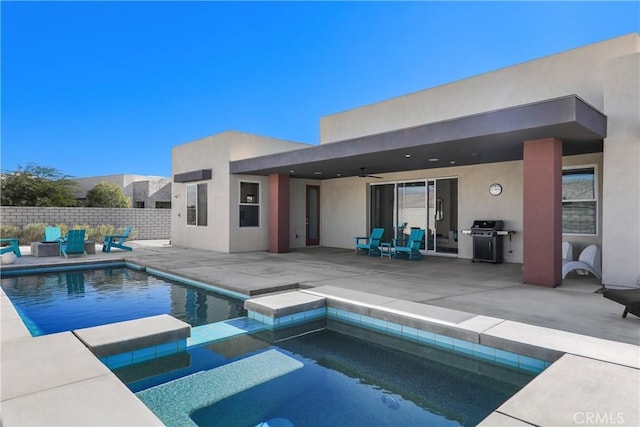 view of pool featuring ceiling fan, an in ground hot tub, area for grilling, and a patio