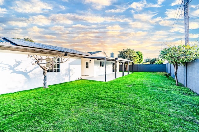 yard at dusk with a patio