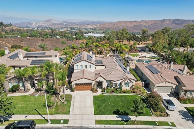 birds eye view of property featuring a mountain view