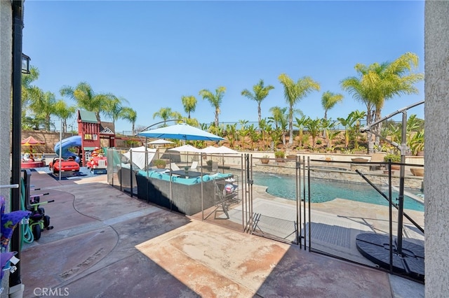 view of swimming pool with a patio