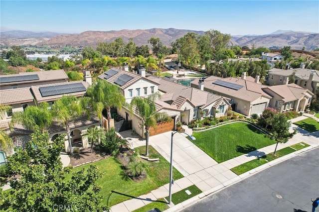 birds eye view of property with a mountain view