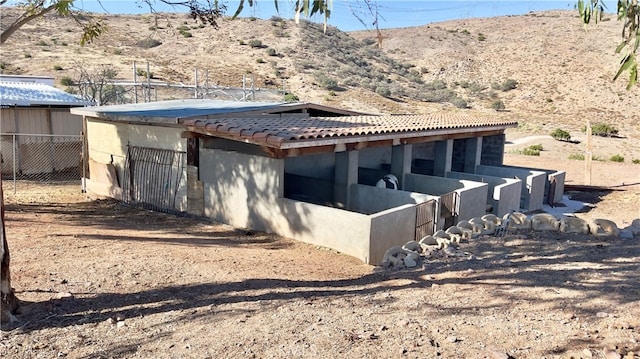 rear view of property featuring a mountain view