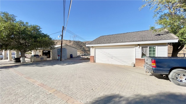 view of side of home featuring an outdoor structure