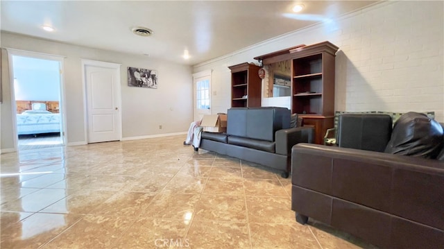 living room with ornamental molding and light tile floors