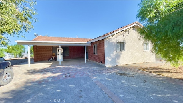 view of front of home with a carport