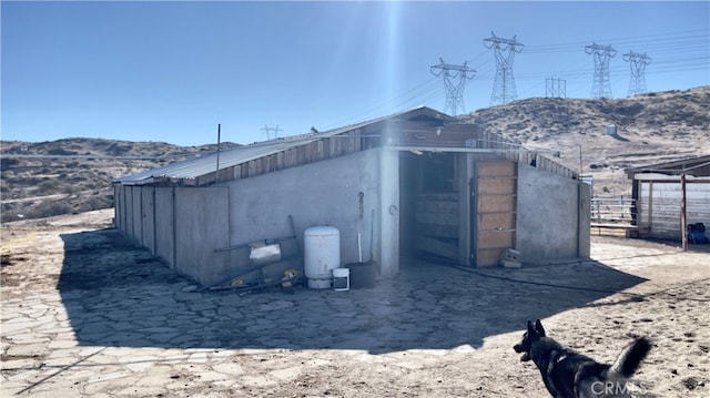 view of shed / structure with a mountain view