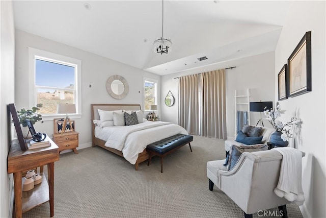 carpeted bedroom featuring multiple windows, vaulted ceiling, and an inviting chandelier