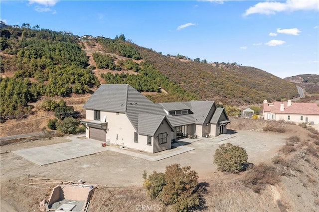 drone / aerial view featuring a mountain view