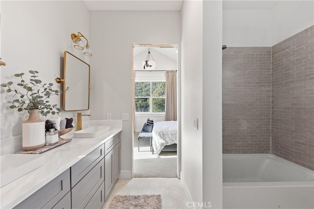 bathroom featuring bathtub / shower combination and vanity