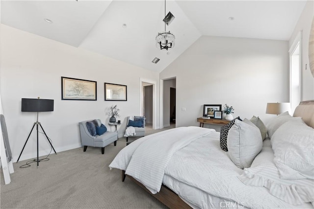 bedroom featuring light carpet, an inviting chandelier, and vaulted ceiling