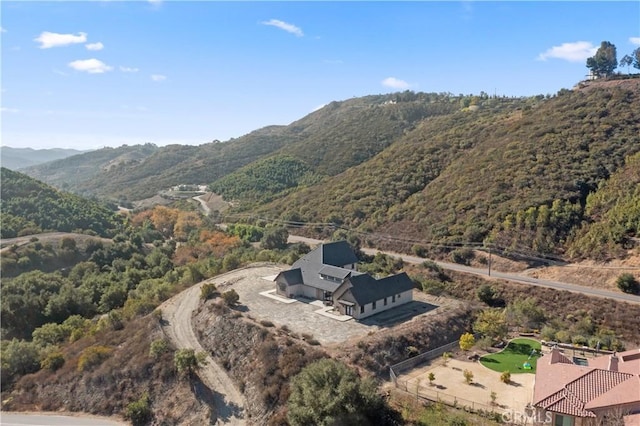 drone / aerial view featuring a mountain view