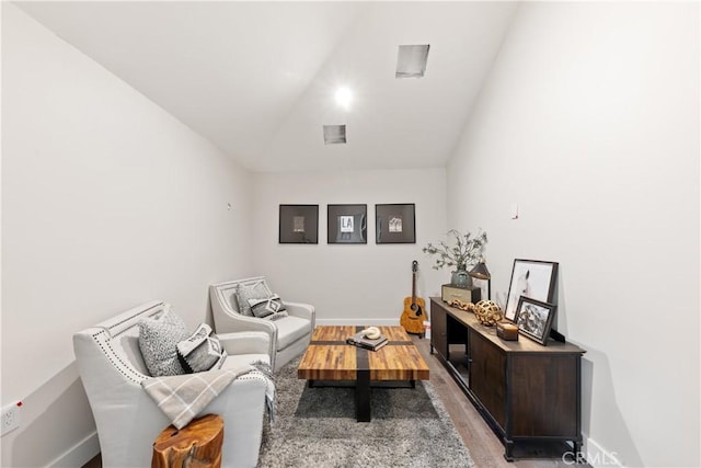 living area with hardwood / wood-style floors