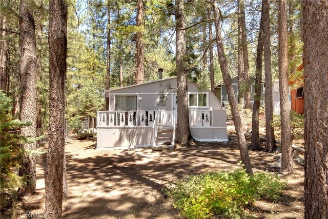 view of front of home with a wooden deck