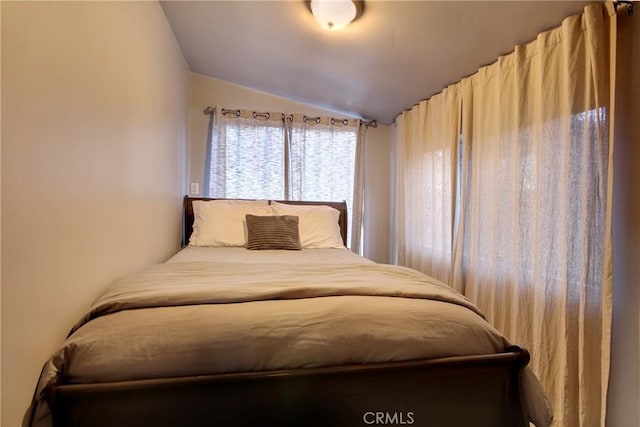 bedroom featuring vaulted ceiling