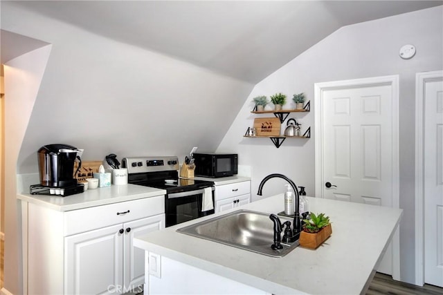 kitchen featuring dark hardwood / wood-style flooring, vaulted ceiling, sink, white cabinetry, and stainless steel range with electric cooktop