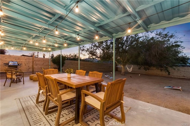 view of patio terrace at dusk