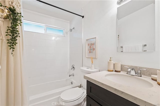 full bathroom featuring washtub / shower combination, oversized vanity, and toilet