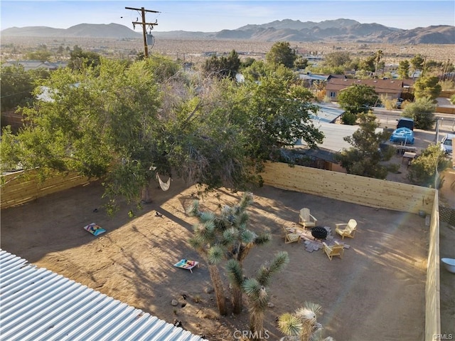 birds eye view of property featuring a mountain view