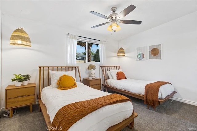 bedroom with dark carpet and ceiling fan