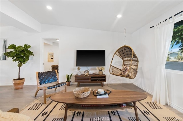 living room featuring vaulted ceiling