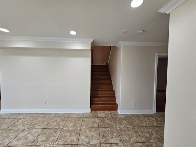 stairway featuring ornamental molding and tile patterned flooring