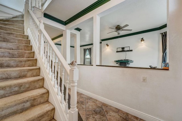 staircase with tile flooring, ceiling fan, and ornamental molding