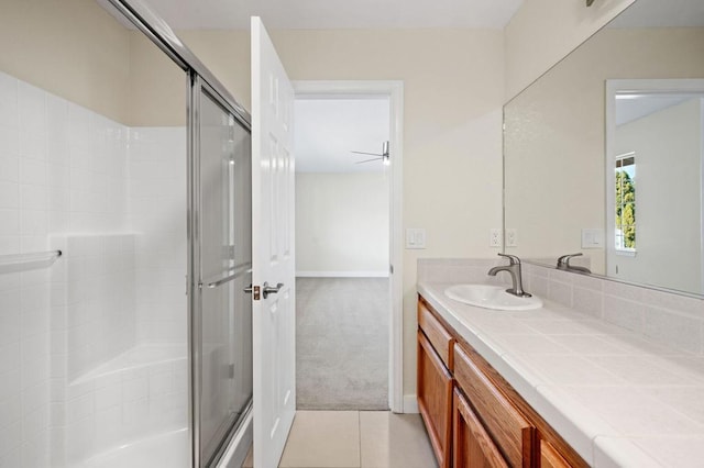 bathroom featuring vanity, tile patterned floors, and ceiling fan