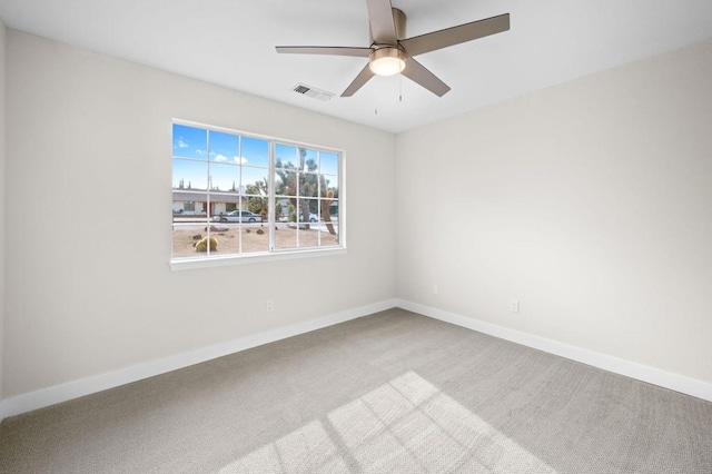 empty room with carpet floors and ceiling fan