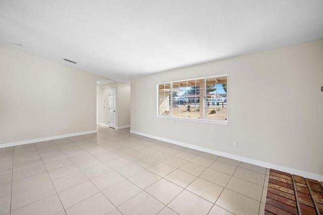 empty room with light tile patterned flooring