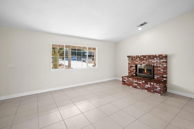 unfurnished living room with light tile patterned floors and a fireplace