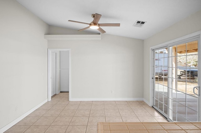 tiled spare room featuring ceiling fan and lofted ceiling