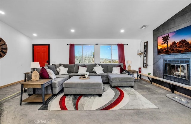 living room with a tiled fireplace