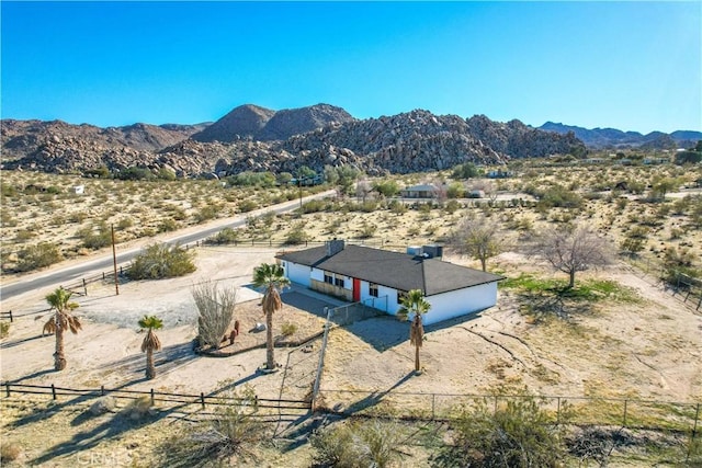 birds eye view of property with a mountain view