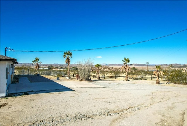 view of yard with a rural view