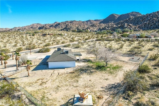 birds eye view of property featuring a mountain view