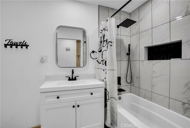 bathroom featuring shower / tub combo and vanity