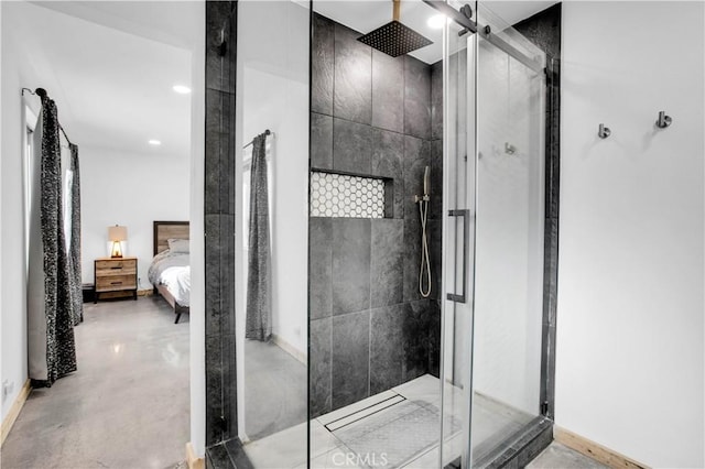 bathroom featuring concrete floors and a shower with shower door