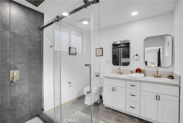 bathroom with concrete floors, an enclosed shower, vanity, and toilet