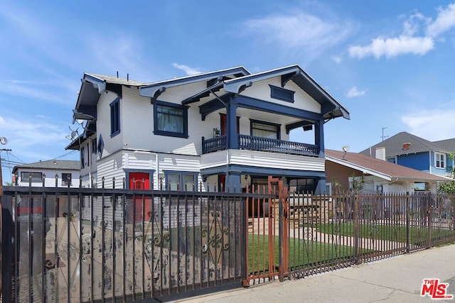 view of front of home featuring a balcony