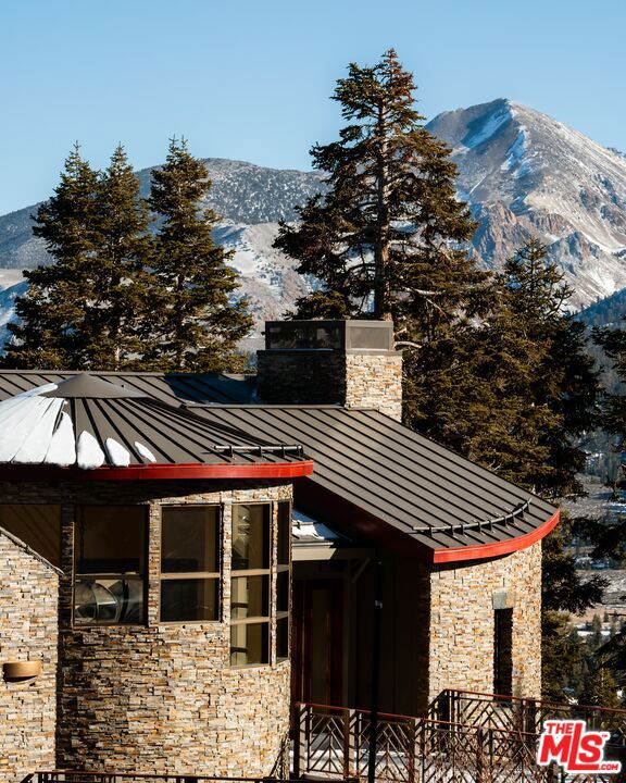 snow covered property with a mountain view