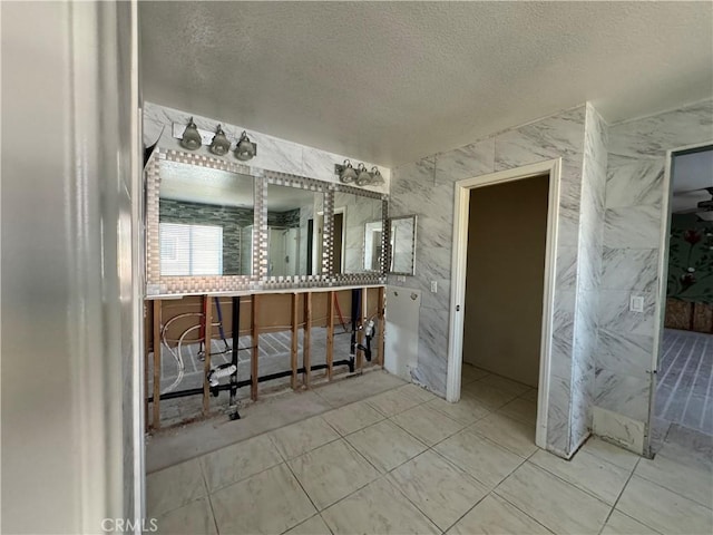 4810 Swallowtail Rd, Hemet, CA 92545 - bathroom with tile patterned floors, vanity, and a textured ceiling