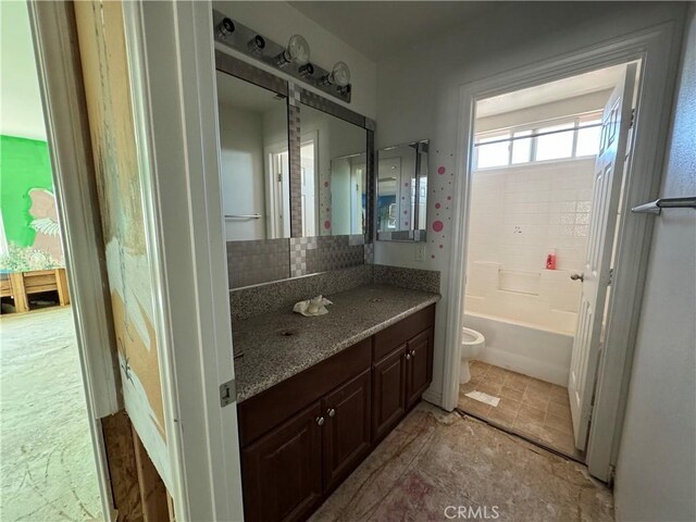 4810 Swallowtail Rd, Hemet, CA 92545 - full bathroom featuring tasteful backsplash, toilet, vanity, and a bath