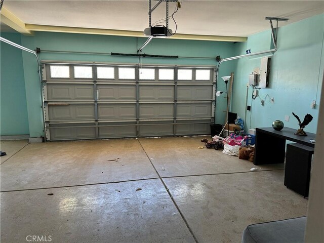 4810 Swallowtail Rd, Hemet, CA 92545 - garage featuring a garage door opener